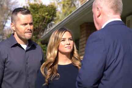Young couple speaking with an attorney