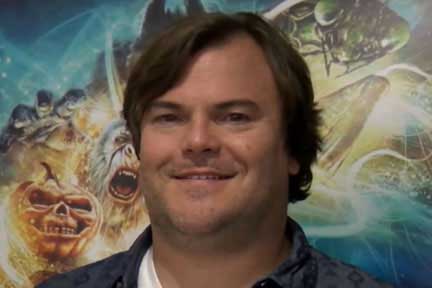 Jack Black in front of Goosebumps poster